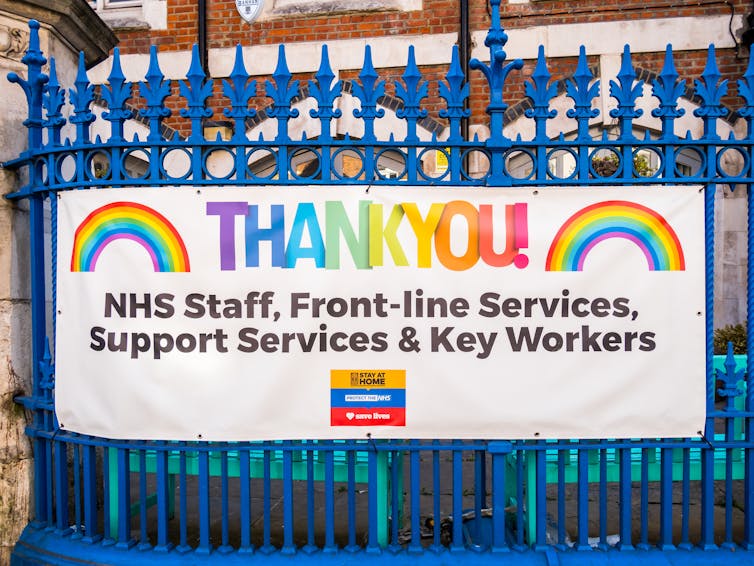 Sign on railings supporting NHS staff during pandemic.